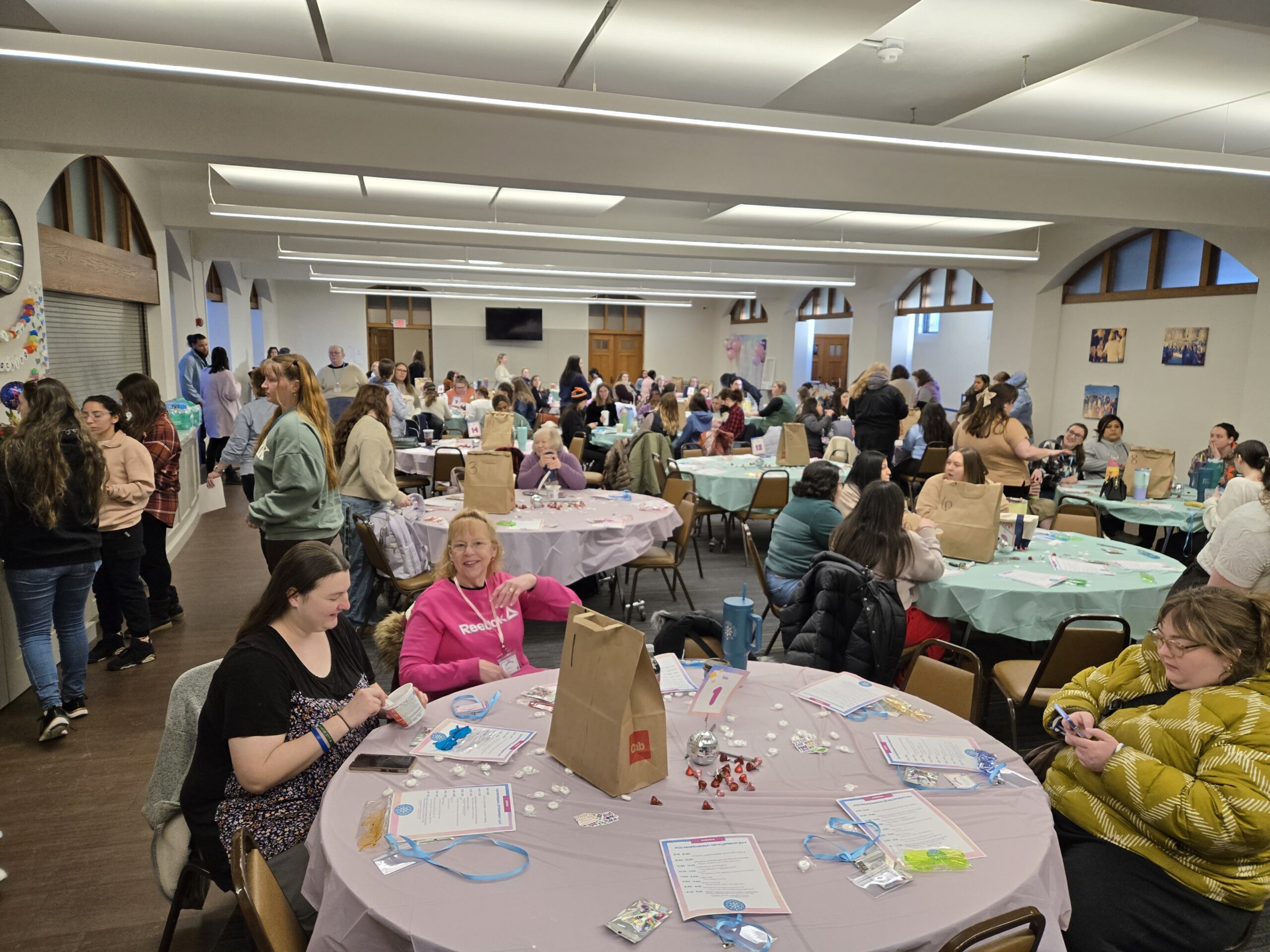 Community room filled with a teacher workshop.